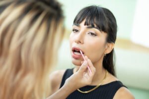 make up artist work on woman business model.artist applying powd